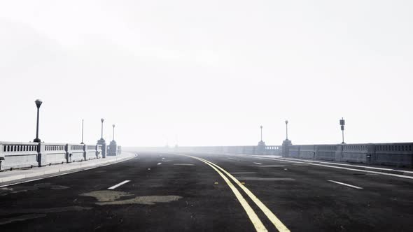 View of the Bridge Over the River in Fog