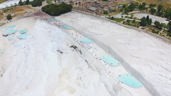 Drone Flies Over the Travertine Terraces in Pamukkale or Cotton Castle