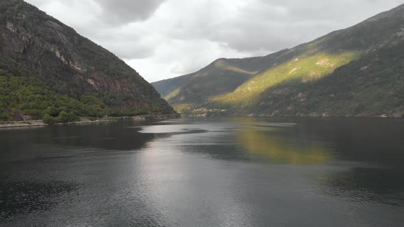 Drone flight exploring a Scandinavian fjord, moody weather