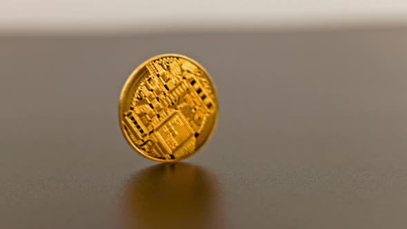 Bitcoin Coin Spinning on Gray Background  Closeup with Slowmo