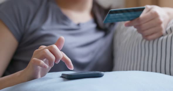 Woman use mobile phone for shopping online with credit card