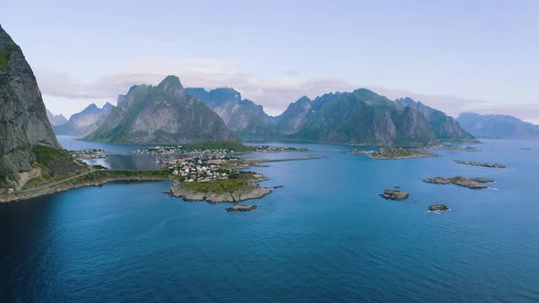 Flying Around Reine Fishing Village with Mountains and Fjords on Lofoten Islands
