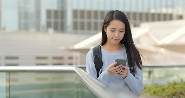 Woman look at cellphone at outdoor