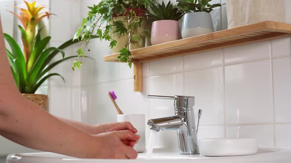 Unrecognisable Woman Washing Hands with Organic Soap
