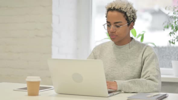 African Woman Closing Laptop Standing Up Going Away