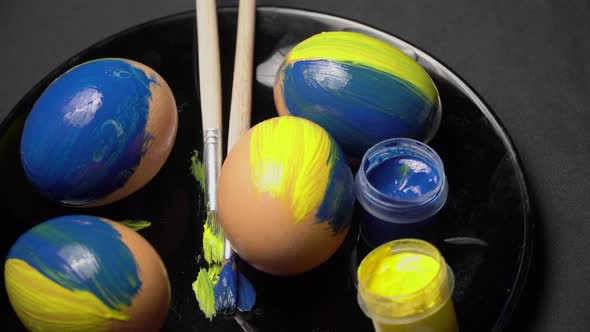 Painted YellowBlue Easter Eggs are Spinning