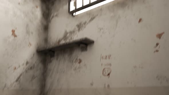 Prison cell with a hole in the wall. Criminal is escaping  using the tunnel