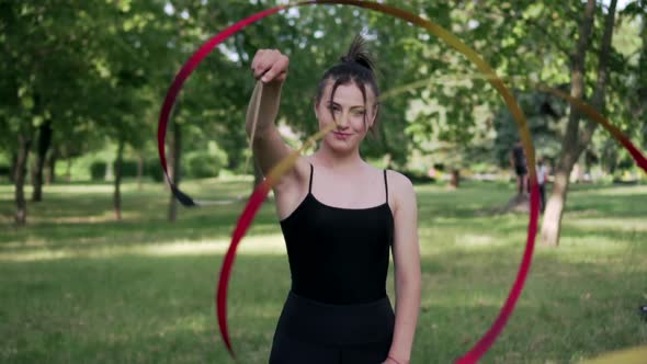 Young Woman Gymnast is Exercising