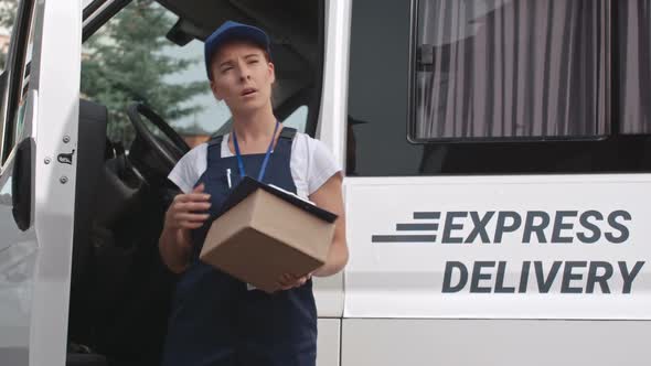 Young Woman Delivering Package