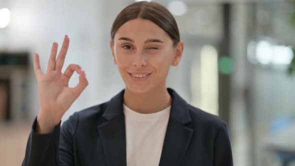 Portrait of Appreciative Businesswoman with Ok Sign By Hand