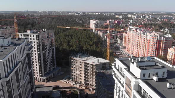 Construction site at apartment complex with high crane