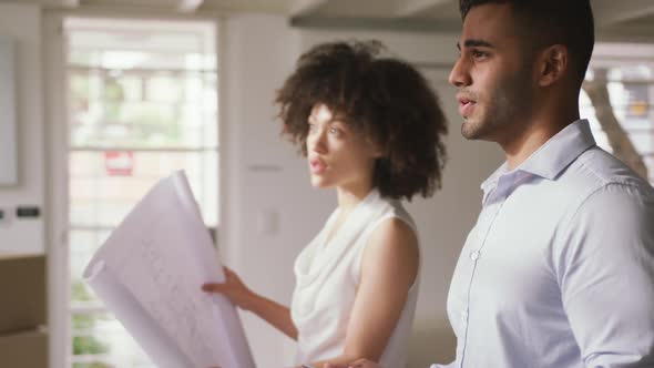 Two colleagues working in creative office