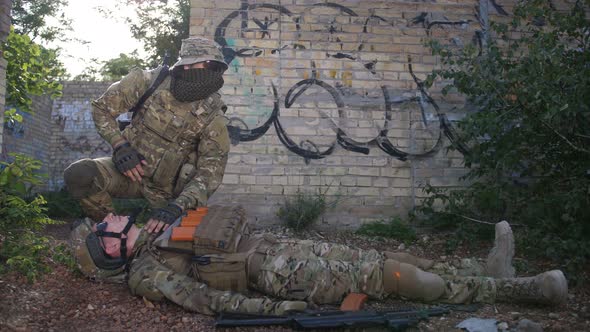 Battlefield Medic Saving Life of Injured Infantryman alt