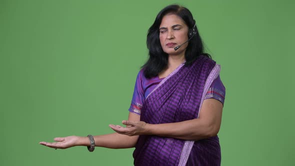 Mature Beautiful Indian Woman As Call Center Representative Showing Something