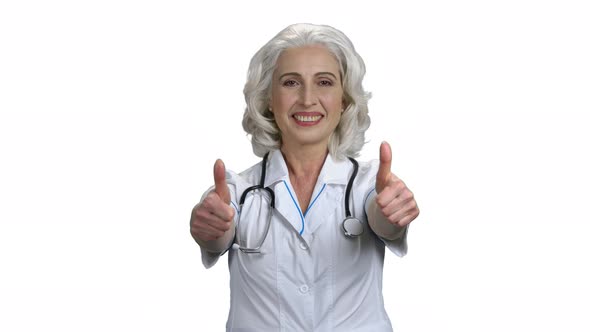 Cheerful Female Doctor Showing Two Thumbs Up