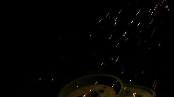 Sparks with gears in ultra slow motion 1500fps on a reflective surface - SPARKS w GEARS 