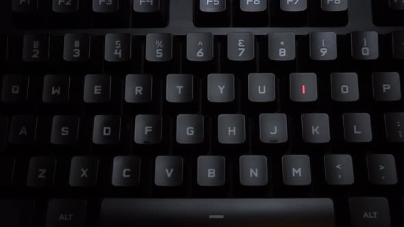 The Word Disease Is Typed on a Luminous Computer Keyboard. Black Backlit Keyboard with Letters. The