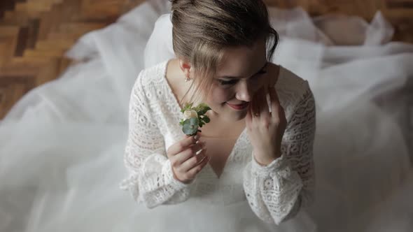 Beautiful, Lovely Bride in Wedding Luxury Dress and Veil. Wedding Morning. Wedding Bouquet