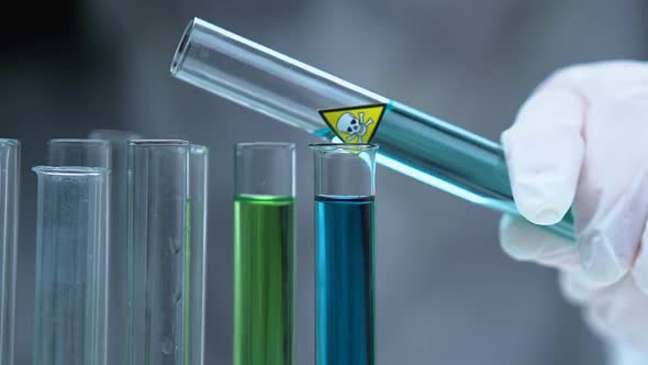 Scientist Adding Poisonous Liquid in Tube for Analyzing Chemical Composition