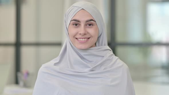Young Arab Woman Smiling at Camera