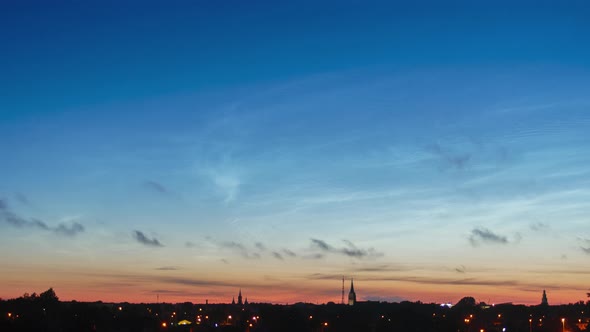 Beautiful time lapse of silvery (noctilucent, polar mesospheric) clouds glowing and shining in a sum