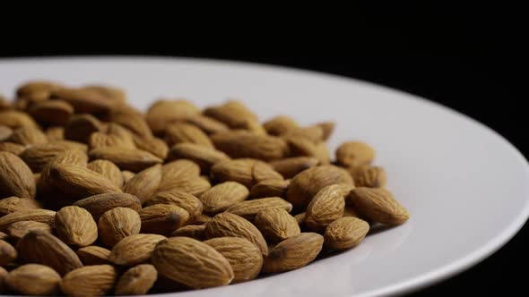 Cinematic, rotating shot of almonds on a white surface - ALMONDS 034
