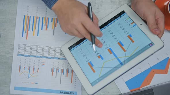 Businessman Hands Analyzing Financial Report