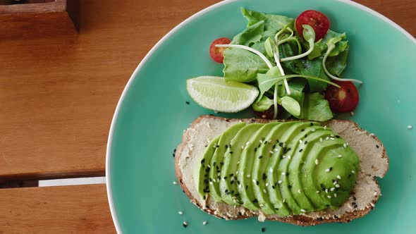 Healthy Avocado Toast with Salad on Plate
