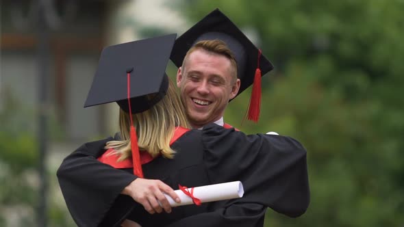 Happy Male and Female University Friends Smiling Sincerely and Hugging Warmly