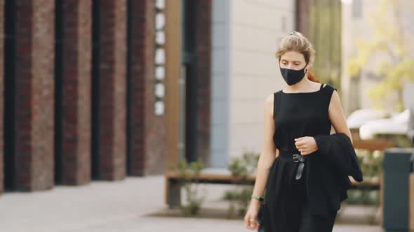 Business People in Protective Masks Walking on Street