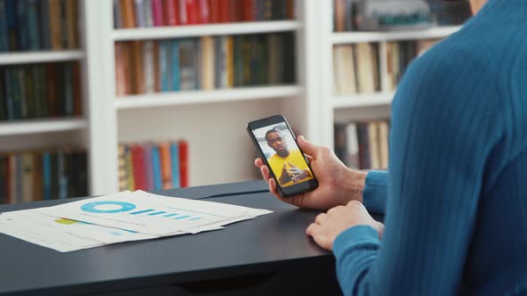 Young teacher communicating by videoconference