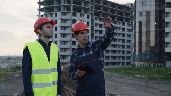 Discussion of Two Workers Outdoor on a Fresh Air