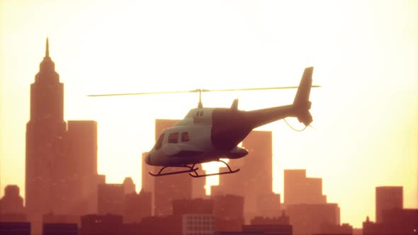 Silhouette Helicopter at City Scape Background