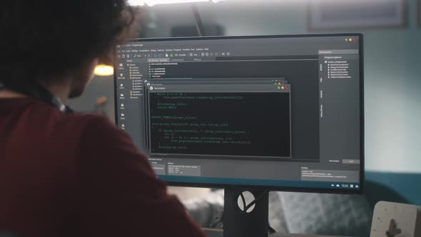 Male Programmer Creating Code at Home