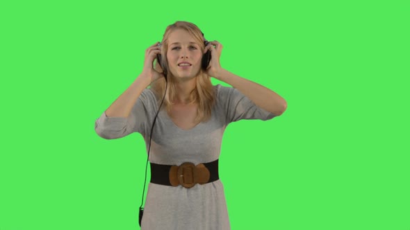 Female listening to music on headphones