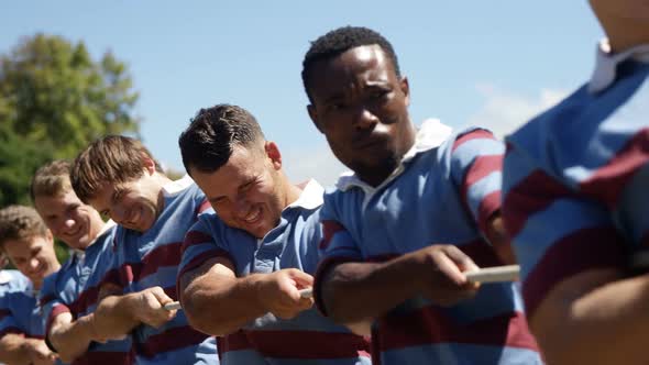 Rugby players playing tug of war