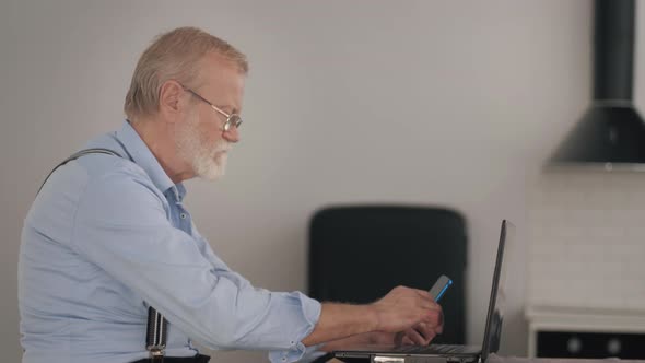 Modern Old Man Handsome Pensioner Confident Gadget User Makes Online Purchases Through Internet