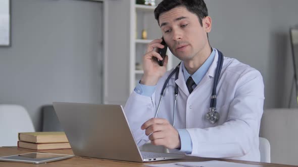 Doctor Talking with Patient in Clinic