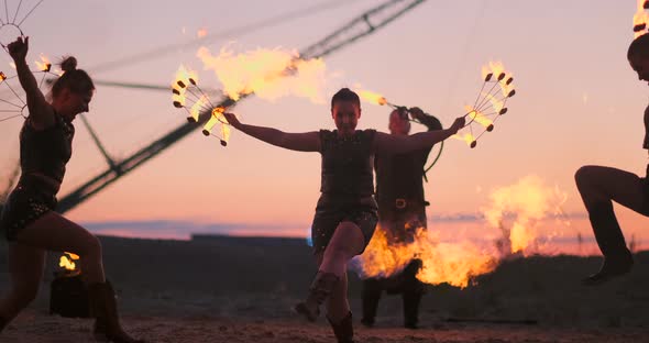 A Group of Professional Circus Performers with Fire Shows Dance Shows in Slow Motion Using