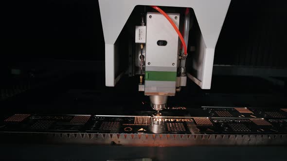 Automatic Cnc Laser Cutting Machine Working with Sheet Metal with Sparks at Factory