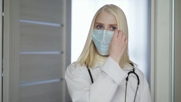 Female Doctor Remove Protective Surgical Mask After Complete Examination Job