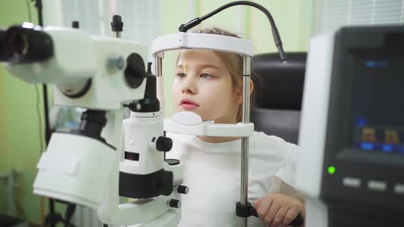 Examination of Girl with Slit Lamp