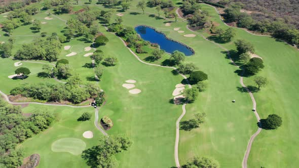 Top View People Driving in White Golf Carts and Playing Golf Game on Course