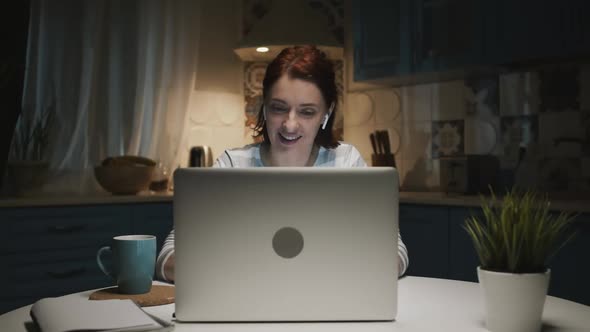 Woman In The Kitchen With Laptop, Woman Tired And Wants To Sleep, She Yawns