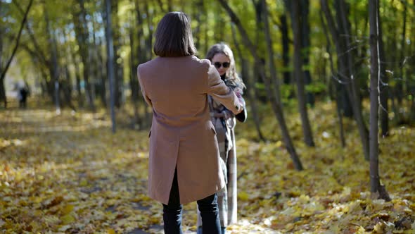 Happy Weekend in Park in Autumn Loving Man and Woman are Holding Hands and Whirling