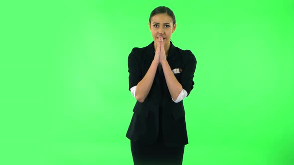 Woman Looking at Camera with Anticipation, Then Very Upset. Green Screen