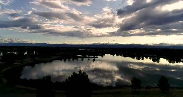 Be humbled in awe at this sunset taken by drone of the Rocky Mountains with reflections in the lakes