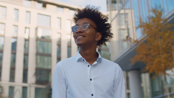 Portrait of Young Afro American Businessman Standing Outdoors Business Center