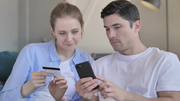 Online Shopping on Smartphone By Young Couple
