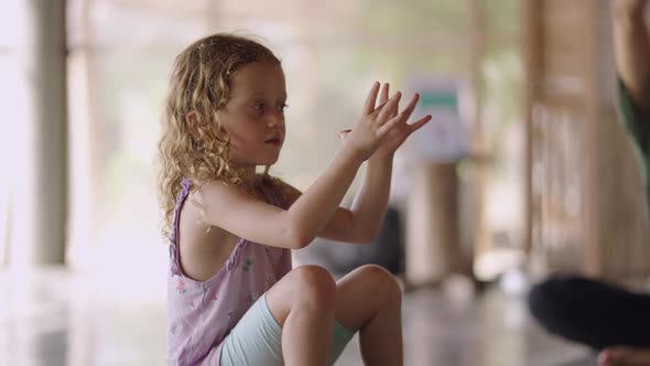 Caucasian Young Kid With Blond Curly Hair On A Yoga Class In Koh Phangan Thailand